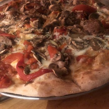 Flatbread Company - Custom pizza with sun-dried tomatoes, bell peppers, mushrooms and pork. - Pizza Near Me - Paia, Hawaii Flatbread Company - Custom pizza with sun-dried tomatoes, bell peppers, mushrooms and pork. - Pizza Near Me - Paia, Hawaii
