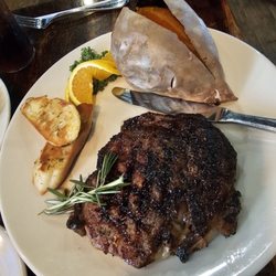Roadhouse 77 - Delicious ribeye!! With baked sweet potato.