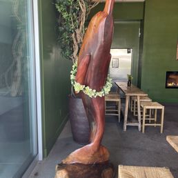 A carved dolphin sculpture in the bar area A carved dolphin sculpture in the bar area