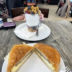 Village Cafe - Egg, sausage, & cheese sandwich and a fruit parfait.