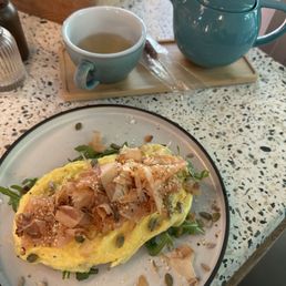 Salmon scramble and pot of green tea Salmon scramble and pot of green tea