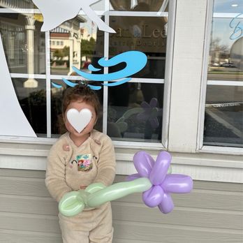 Doan & Lee DDS Pediatric Dentistry - She loves her handmade balloon from the Doctor! - Pediatric Dentists Near Me - Tracy, California Doan & Lee DDS Pediatric Dentistry - She loves her handmade balloon from the Doctor! - Pediatric Dentists Near Me - Tracy, California
