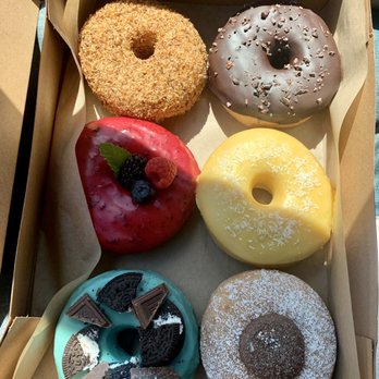 Good Town Doughnuts - Toasted Coconut, Chocolate Cocoa Nibs, triple berry, mango coconut, Nutella, and and mint cookie crunch of some sort. - Donuts Near Me - Costa Mesa, California Good Town Doughnuts - Toasted Coconut, Chocolate Cocoa Nibs, triple berry, mango coconut, Nutella, and and mint cookie crunch of some sort. - Donuts Near Me - Costa Mesa, California