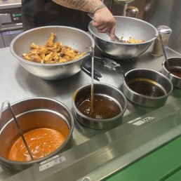 a man preparing food in a kitchen a man preparing food in a kitchen