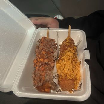 Kong Dog - #4 Churro Kong Dog on left #9 Sweet Chili Doritos Kong Dog on right - Korean Near Me - Gretna, Nebraska Kong Dog - #4 Churro Kong Dog on left #9 Sweet Chili Doritos Kong Dog on right - Korean Near Me - Gretna, Nebraska