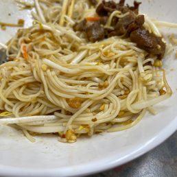  a plate of noodles and meat