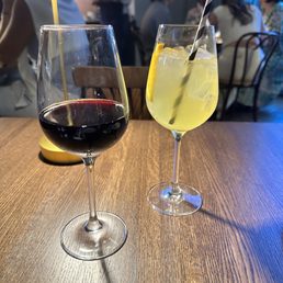 Glass of red and romera spritz