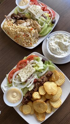 Photo of Restaurant Marathon Souvlaki - Laval, QC, CA. Pork Souvlaki plate with fries + Half&Half pork gyro and chicken shawarma with rice plate w/ tzatziki side.