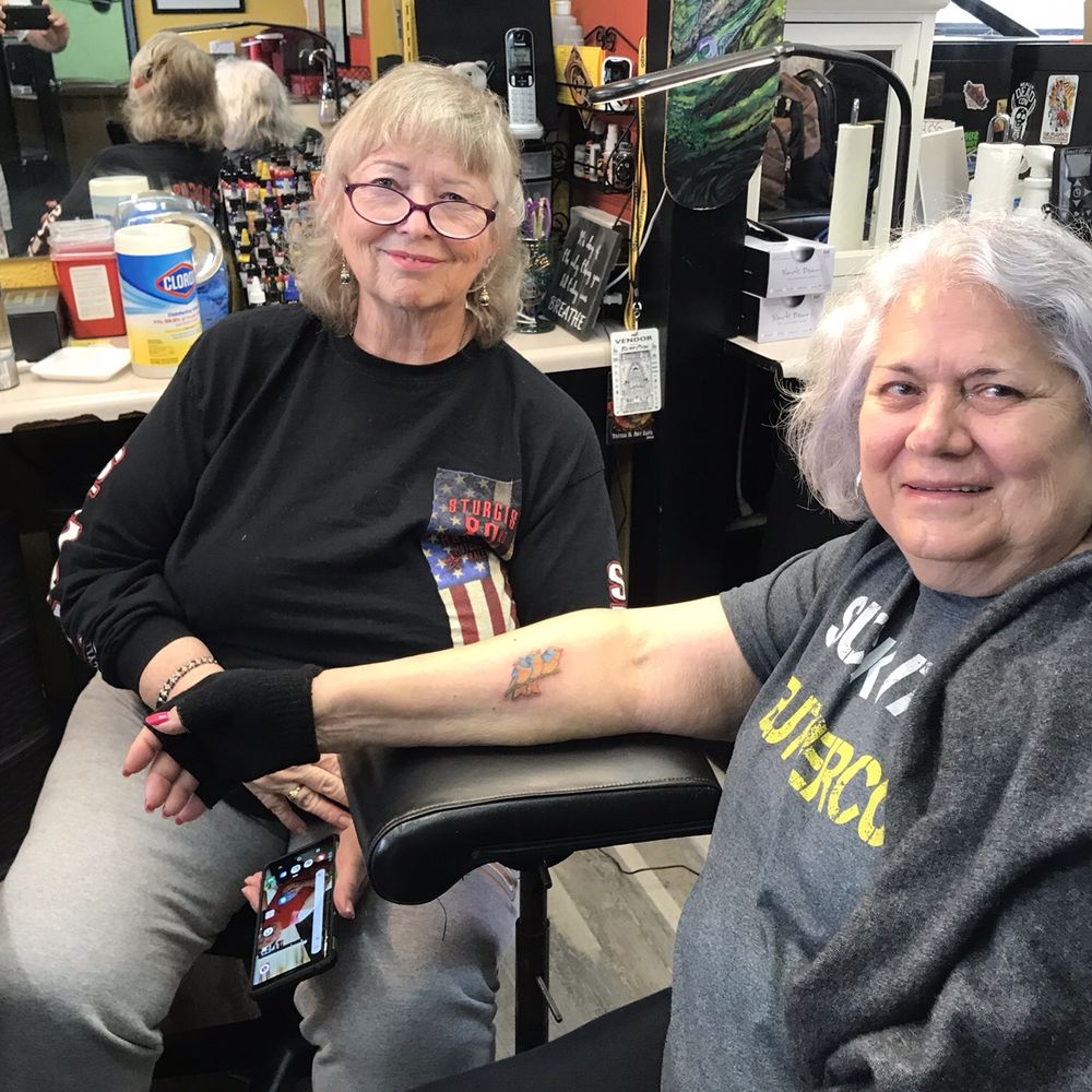 Central Coast Tattoos - Chrys the Artist and a newbie. - Tattoo Near Me - Morro Bay, California Central Coast Tattoos - Chrys the Artist and a newbie. - Tattoo Near Me - Morro Bay, California