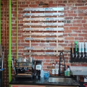 Wasted Day Brewing - a kitchen with a brick wall - Breweries Near Me - Saint John, New Brunswick