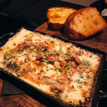 Bar Corso - a pan of lasagna and bread - Wine Bars Near Me - Vancouver, British Columbia