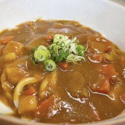 a bowl of soup with noodles and vegetables a bowl of soup with noodles and vegetables