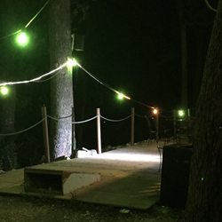Jim & Deb's Lakeside Pub - Outdoor lighting and cornhole court