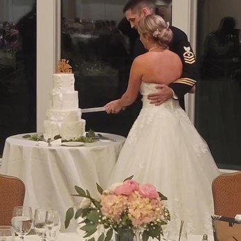 Cakes by Crystal - a bride and groom cutting their wedding cake - Custom Cakes Near Me - Chesapeake, Virginia