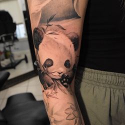Mor Ink Tattoo - Realistic tattoo of panda sleeping