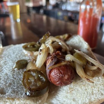 Parish Publick House - Bacon-wrapped hot dog with grilled peppers and onions on a toasted roll (8 out of 10) - Bars Near Me - Santa Cruz, California Parish Publick House - Bacon-wrapped hot dog with grilled peppers and onions on a toasted roll (8 out of 10) - Bars Near Me - Santa Cruz, California