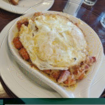 Brunch Cafe-Roselle - Skillet with sweet potato tots, eggs over medium. - Breakfast & Brunch Near Me - Roselle, Illinois