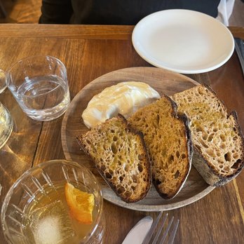 Sesamo - Anadama bread with honey butter and sea salt. - Italian Near Me - New York, New York Sesamo - Anadama bread with honey butter and sea salt. - Italian Near Me - New York, New York