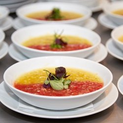 Two soups in one bowl: red and yellow gazpacho
