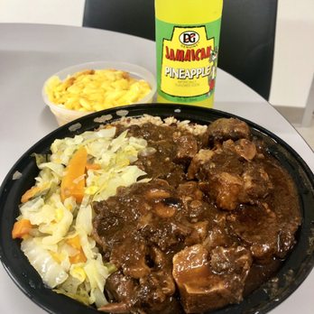Caribbean Starr Restaurant - Large Oxtail over Rice & Beans with Cabbage topped with gravy ($15) plus a side of Mac & Cheese - Caribbean Near Me - New York, New York