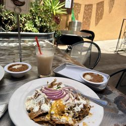 Chilaquiles with carnitas and rajas con queso, very good authentic Mexican food