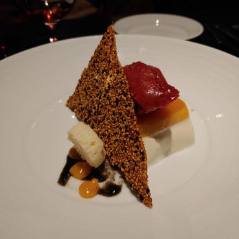 Plate - The coconut mango dessert was so interesting and tasty! The sesame cracker makes it. - Cocktail Bars Near Me - Kansas City, Missouri Plate - The coconut mango dessert was so interesting and tasty! The sesame cracker makes it. - Cocktail Bars Near Me - Kansas City, Missouri