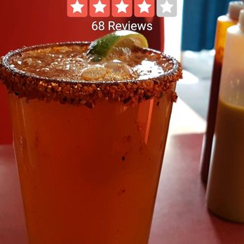 Ta Chido - a glass of beer with a lime garnish - Mexican Near Me - Montreal, Quebec