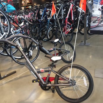 REI - This is neat, pull your young one behind you on their own bike. - Sports Wear Near Me - Southlake, Texas REI - This is neat, pull your young one behind you on their own bike. - Sports Wear Near Me - Southlake, Texas