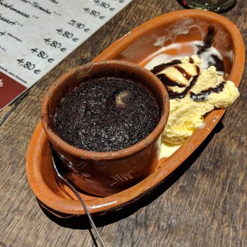 Carlos - Lava cake with vanilla ice cream and chocolate syrup - Portuguese Near Me - Lünen, NW