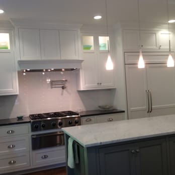 Kizanis Custom Cabinets - a kitchen with white cabinets - General Contractors Near Me - San Leandro, California
