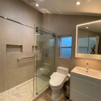 Buildoly  - Bathroom with tile walls and vaulted ceiling & skylight. - Interior Design Near Me - Los Angeles, California