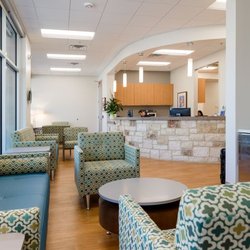 University Health Dominion Crossing - Lobby and seating area inside Reception counter at University Health Dominion Crossing
