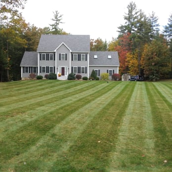 Erhardt and Shallow Landscaping - a large lawn with a house in the background - Landscaping Near Me - Hampstead, New Hampshire Erhardt and Shallow Landscaping - a large lawn with a house in the background - Landscaping Near Me - Hampstead, New Hampshire