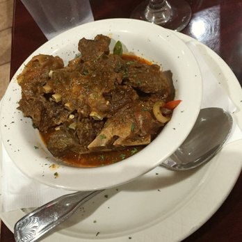 Punta Cana - Chivo Guisado (stewed goat), my sides were Arroz Amarillo (yellow rice) and Platanos Maduros (sweet plantains) but were sadly not pictured! - Caribbean Near Me - Charlotte, North Carolina