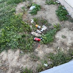 Mega Saver - Lot is covered end to end in trash.