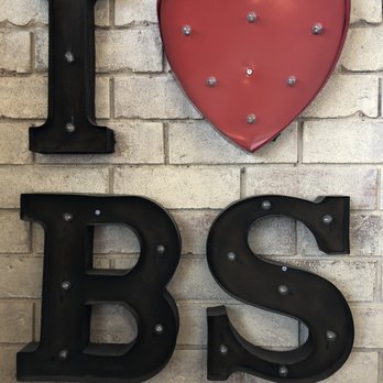 Burrito Splendido - a brick wall with letters and a heart - Mexican Near Me - Winnipeg, Manitoba