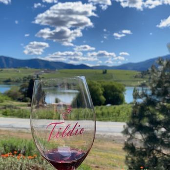 Tildio Winery - a hand holding a wine glass - Wineries Near Me - Manson, Washington Tildio Winery - a hand holding a wine glass - Wineries Near Me - Manson, Washington