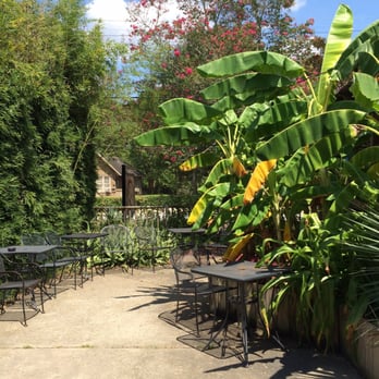 Garden District Coffee - The lush outside seating area. - Coffee & Tea Near Me - Baton Rouge, Louisiana Garden District Coffee - The lush outside seating area. - Coffee & Tea Near Me - Baton Rouge, Louisiana