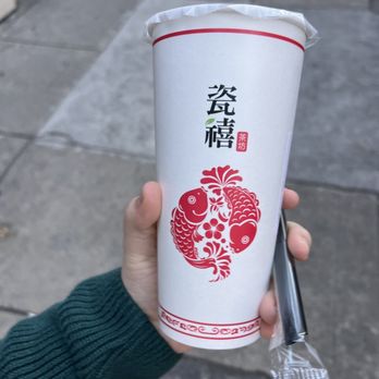 Teazzi Tea Shop - a person holding a cup of tea - Bubble Tea Near Me - Philadelphia, Pennsylvania Teazzi Tea Shop - a person holding a cup of tea - Bubble Tea Near Me - Philadelphia, Pennsylvania