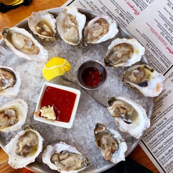 Scottie's On The River - Oysters on the Half Shell.  We had never dipped oysters in Mignonette (vinegar, shallots, & cracked peppercorn) but is now a must have! - Seafood Near Me - Chattanooga, Tennessee