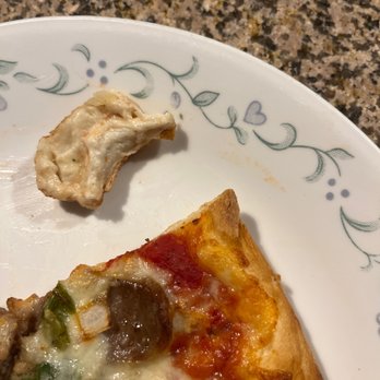 SliceWorks Thornton - Air fryed slice with raw dough piece from center. - Pizza Near Me - Denver, Colorado