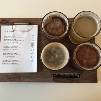 33 Acres Brewing - Our yummy beer flight - white paper detailing which beers we ordered! - Breweries Near Me - Vancouver, British Columbia
