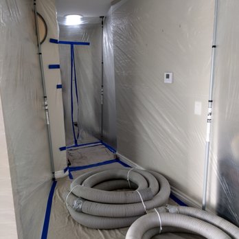 Insulation Labs - Plastic "tunnel" from front door to attic access for dust control. - Insulation Installation Near Me