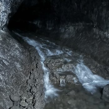 Kaumana Caves - Waterfall inside the cave. This is as far as we went. - Parks Near Me Kaumana Caves - Waterfall inside the cave. This is as far as we went. - Parks Near Me