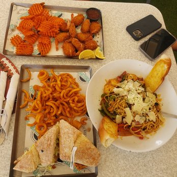 Quarterdeck Restaurants - Mahi mahi (El Dorado) sandwich. Coconut shrimp with sweet potato fries and jambalaya spaghetti - Seafood Near Me - Dania Beach, Florida Quarterdeck Restaurants - Mahi mahi (El Dorado) sandwich. Coconut shrimp with sweet potato fries and jambalaya spaghetti - Seafood Near Me - Dania Beach, Florida