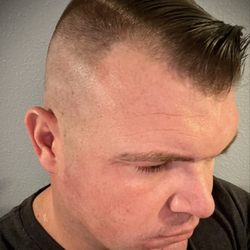 850 Cuts - High skin fade with a hard part on the right side.