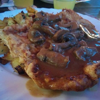Apfelwein Wagner - Deeeeelicious Jagerschnitzel: pork cutlet with mushrooms and gravy and delicious herb and garlic potatoes. - German Near Me - Frankfurt, HE