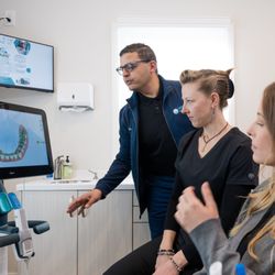 Modern Dentistry of New England - Modern Dentistry of New England team looking over a scan