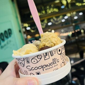Scoopwell's Dough Bar - a hand holding a cup of ice cream - Desserts Near Me - Gilbert, Arizona Scoopwell's Dough Bar - a hand holding a cup of ice cream - Desserts Near Me - Gilbert, Arizona