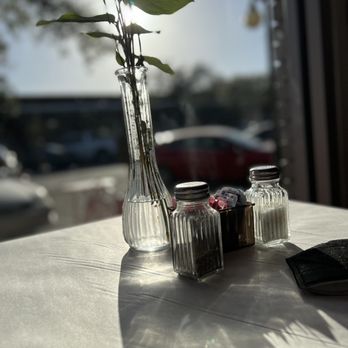 Aunny's - a vase of flowers and salt and pepper shakers - Southern Near Me - Georgetown, South Carolina Aunny's - a vase of flowers and salt and pepper shakers - Southern Near Me - Georgetown, South Carolina